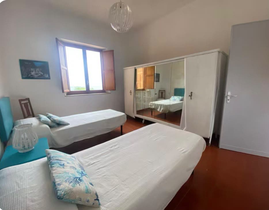 Bedroom with a mirrored wardrobe