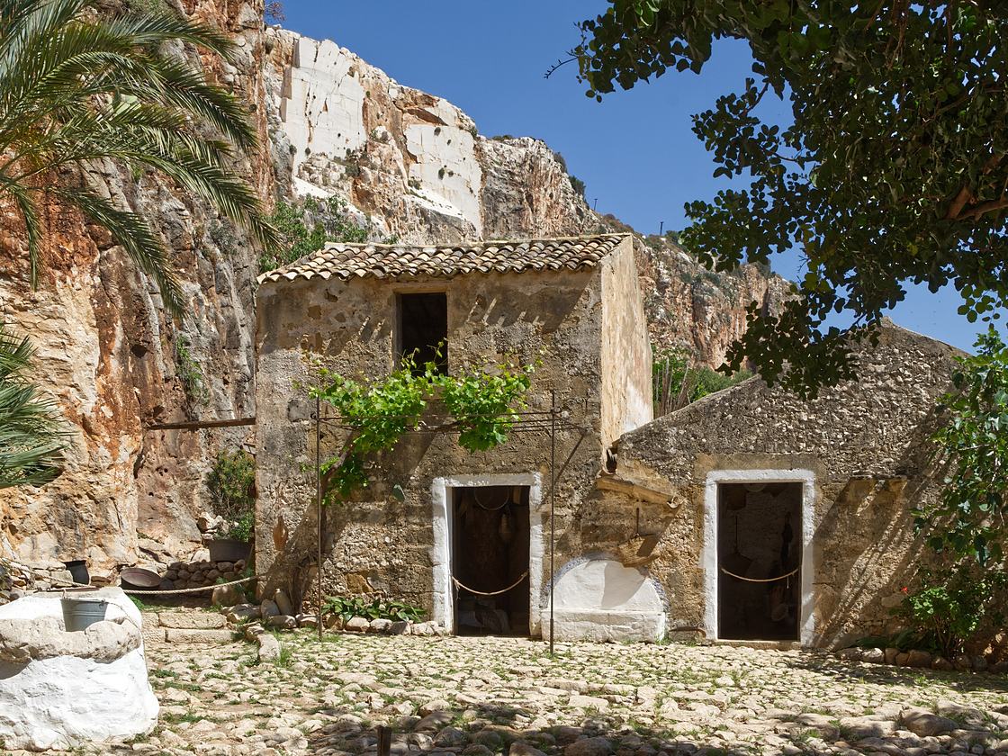 The stone houses of the Mangiapane Cave, built against the rock face