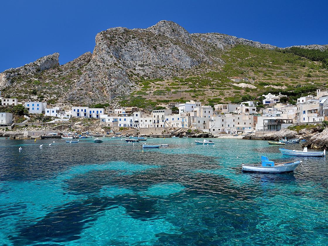 The harbour of Levanzo, in the Aegadian Islands, with boats on the clear water