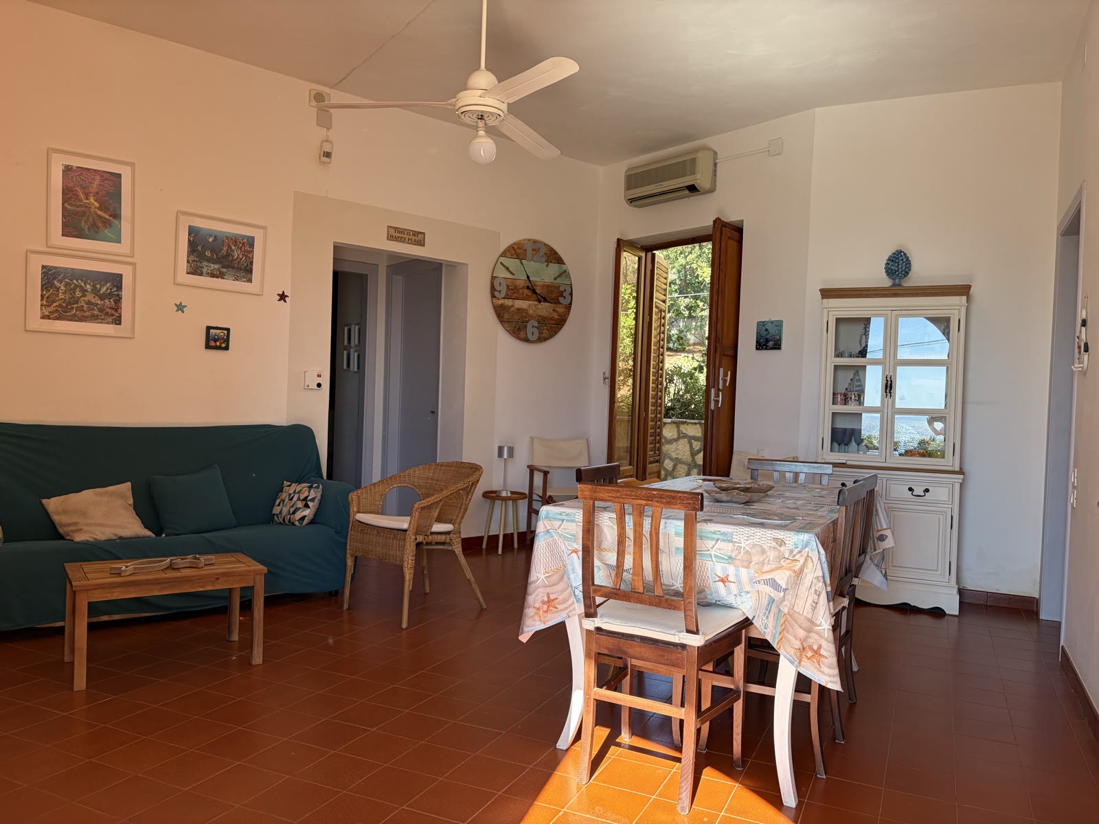Living room with sofa, dining table and sideboard